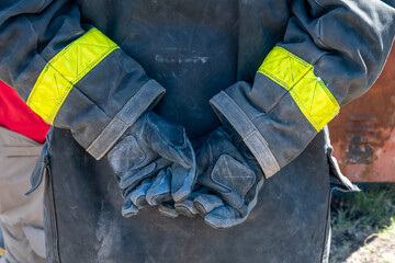 hands of firefighters with gloves on their hands