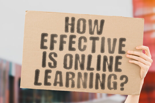 The question " How Effective Is Online Learning? " on a banner in men's hand with blurred background. Education. School. Knowledge. Learn. Teach. Distance. Internet