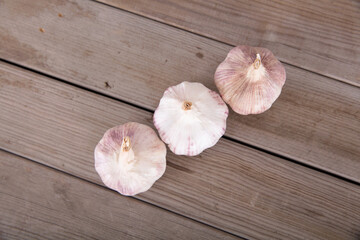 Looking down at the neat rows of garlic on the table