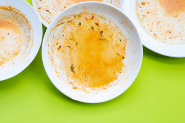 Dirty dishes on green background. Top view