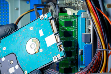 hard disk drive or hdd close up view. technician installing hdd to a desktop pc. inside view. pc repair service concept