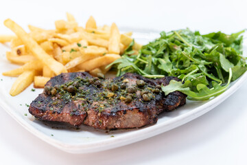 New york Strip streak served with french fries and arugula salad makes a great protein, starch, and greens meal