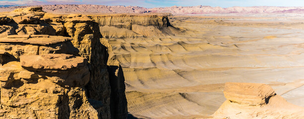 Sandstone Outcropping Extending Over The Lunar Like  Landscape of Moonscape Overlook, Near Hanksville, Utah, USA