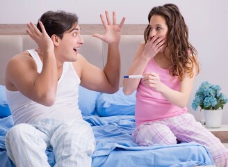 Young family with pregnancy test results