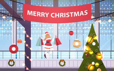 santa woman with gifts walking in shopping mall decorated for merry christmas and new year winter holidays celebration big store interior horizontal full length vector illustration