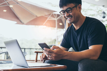 using texting cell phone.man typing computer.chatting on mobile,laptop contact us at workplace Thinking investment plan Investor.searching information use internet.connecting people concept