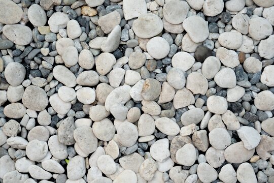 Gray rock, gavel, pebble texture pattern gravel full frame stone background