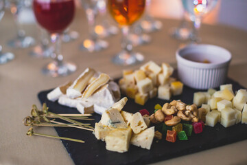 Beautifully decorated catering banquet table with different food snacks and appetizers on corporate christmas birthday party event or wedding celebration