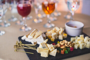 Beautifully decorated catering banquet table with different food snacks and appetizers on corporate christmas birthday party event or wedding celebration