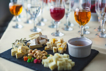 Beautifully decorated catering banquet table with different food snacks and appetizers on corporate christmas birthday party event or wedding celebration