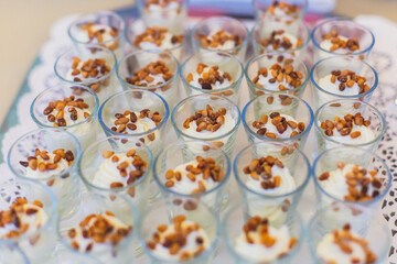 Beautifully decorated catering banquet table with different food snacks and appetizers on corporate christmas birthday party event or wedding celebration