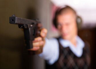 Shooting a combat pistol in the shooting range