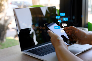 Hand using smartphone with social media concept.