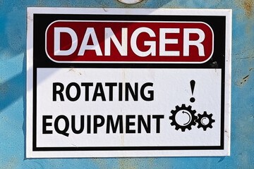 Closeup of a Danger Rotating Equipment sign