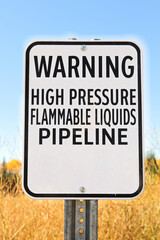 Fototapeta premium A Warning High Pressure Pipeline Flammable Liquids sign