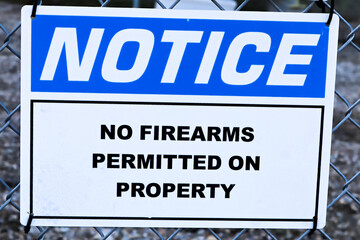 A Notice, No Firearms Permitted on Property sign