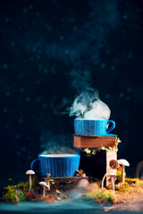 Magical potion in ceramic cups with rising steam and mushrooms