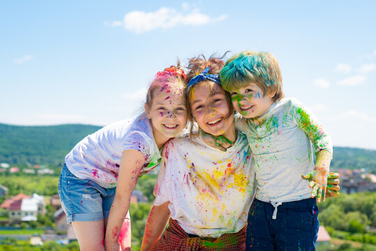 Kids painted in the colors of Holi festival.