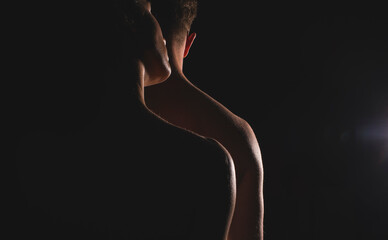 Portrait of young couple in love posing at studio