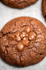 Classic chocolate chip cookies freshly baked, food background.