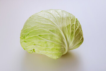 Fototapeta premium Organic green cabbage isolated on white background.