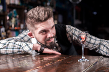 Barman mixes a cocktail on the alehouse