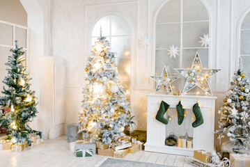 Bright cozy living room with a large elegant Christmas tree, decorated for Christmas