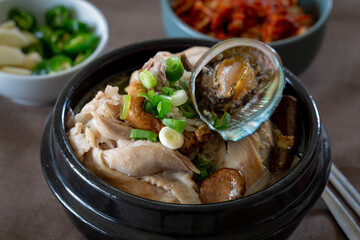 Ginseng chicken soup with abalone which is called Jeonbok Samgyetang