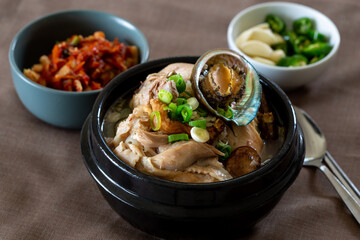 Ginseng chicken soup with abalone which is called Jeonbok Samgyetang