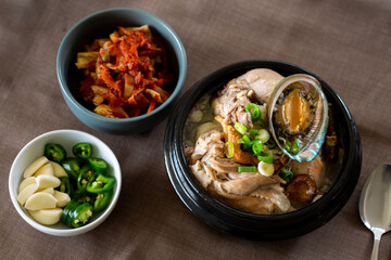 Ginseng chicken soup with abalone which is called Jeonbok Samgyetang