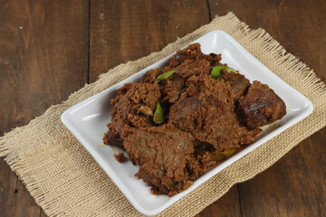 Selected Focus Rendang or Randang is The Most Delicious Food in the World. Made from Beef Stew and Coconut Milk with Various Herbs and Spice. Typically food from Minang Tribe, West Sumatera, Indonesia