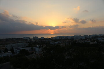 Fototapeta premium view of the city at sunset from the top of the Church of St. Elias Cyprus Protaras