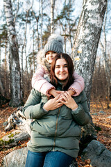 Mother and daughter in nature, forest or Park, walk communication and health