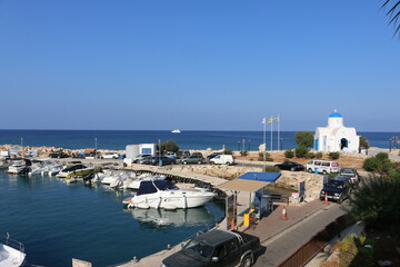 Cyprus. Protaras. Boat mooring. Mediterranean coast. A pier near the church of St. Nicholas. Yachts moored off the coast of Cyprus. Lagoon near the city of Protaras. Tourism to Cyprus. Guide.