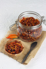 Sambal balado teri kacang is fried anchovy and peanuts with hot and spicy chili sauce. An Indonesian traditional food.