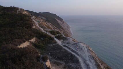 photo from a quadcopter, on a cliff, high coast, sea, rest, travel on rocky terrain