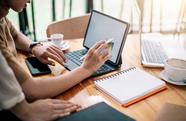 Fototapeta premium Close Up . Hands of woman designer using digital tablet to work at home or in the office.