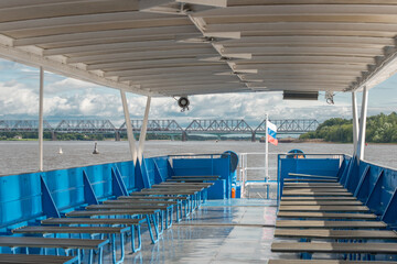Empty passenger seats on a pleasure boat on a summer day