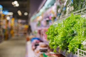 Fresh greens, dill, seasonings close-up top view on the counter of the vegetable market. 