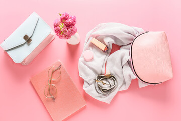 Composition with cosmetics and headscarf in bag on color background