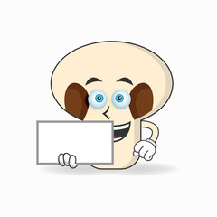 mushrooms mascot character holding a white blackboard. vector illustration
