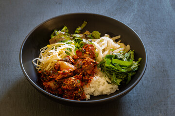 Korean food, Kkomag Bibimbab which is mixed with rice, vegetables and blood cockle