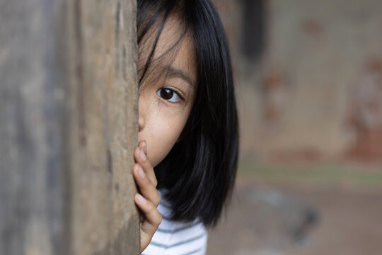 Little girl with eye sad and hopeless. Human trafficking and fear child concept.