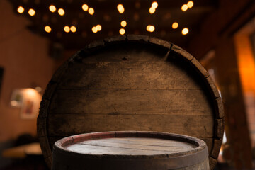 Old wooden barrel on a brown background