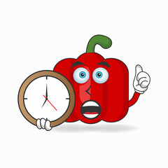 Red paprika mascot character holding a wall clock. vector illustration