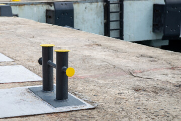 Mooring bollard on a wharf, to which a ship's rope may be secured