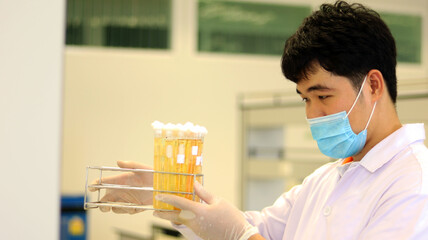 Scientist analysis the results of Most Probable number (MPN) technique for counting the Coliform...