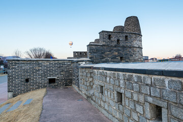 Hwaseong fortress and watch tower in Suwon city, South Korea. A famous touristic site of stone wall built in the late 18th century, UNESCO World Heritage Site.