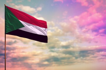 Fluttering Sudan flag mockup with the space for your content on colorful cloudy sky background.