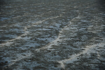 Close up of natural sand surface at the beach after low tide, nobody